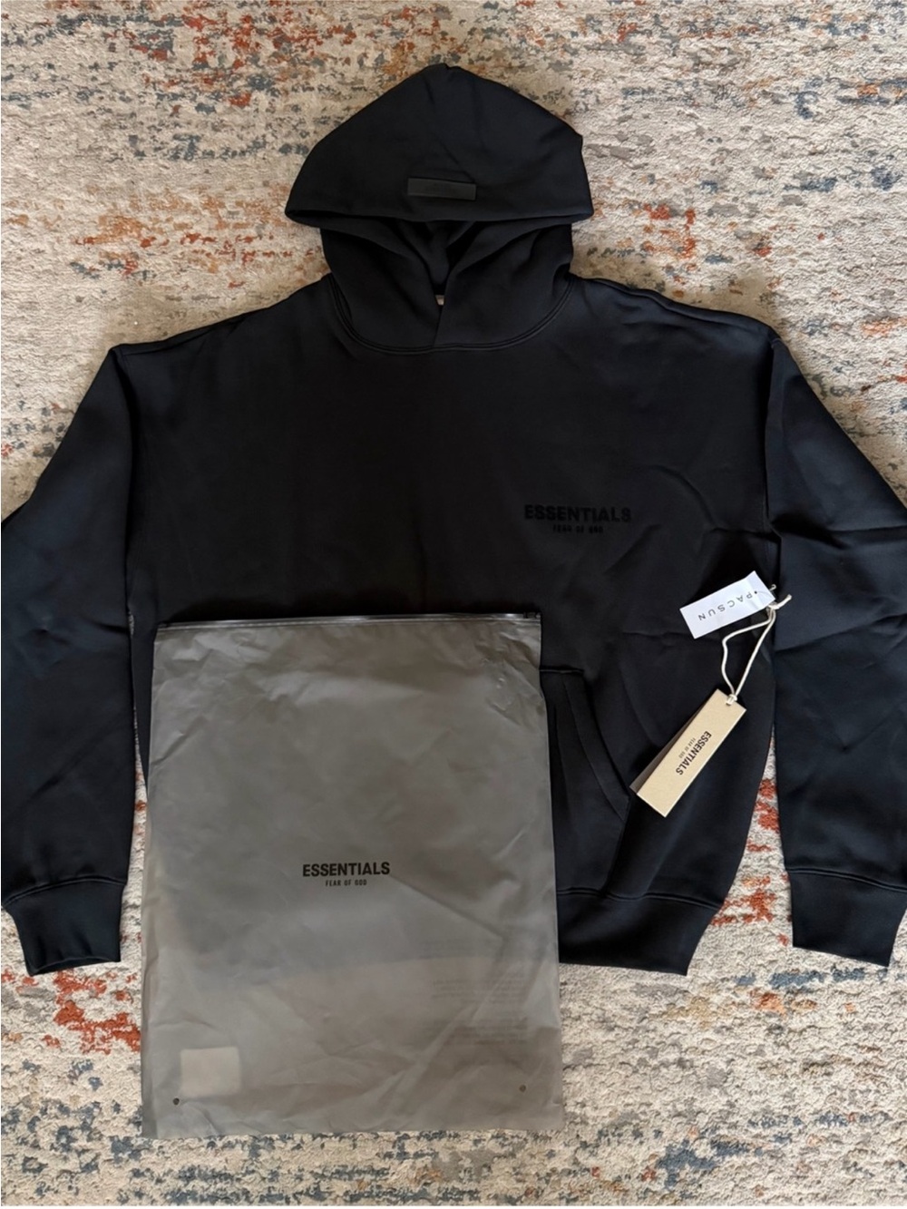 Essentials Black Pullover Hoodie with Subtle Chest Logo
